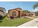 Inviting single-story home with verdant lawn and garden beds framing the house at 13128 Foxtail Fern Dr, Riverview, FL 33579