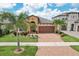 Charming single-story home with a well-manicured lawn and beautiful landscaping at 13128 Foxtail Fern Dr, Riverview, FL 33579
