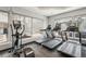Community gym featuring modern treadmills, elliptical machines, and large windows for natural light and views at 13128 Foxtail Fern Dr, Riverview, FL 33579