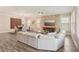 Open-concept area featuring a living room and dining space with modern decor and ample natural light at 13128 Foxtail Fern Dr, Riverview, FL 33579