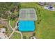Aerial view of tennis and basketball courts surrounded by greenery and landscaping at 13128 Foxtail Fern Dr, Riverview, FL 33579