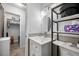 Bathroom with modern vanity, sleek mirror, and adjacent walk-in closet, offering ample storage space at 1641 Jeffords St, Clearwater, FL 33756