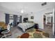 Bedroom with tile flooring, neutral walls, and sliding glass doors to a pool at 1641 Jeffords St, Clearwater, FL 33756