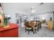 Bright dining room featuring a wood table set, decorative lighting, and an open floor plan concept at 1641 Jeffords St, Clearwater, FL 33756