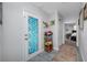 Hallway featuring a patterned glass door and decorative storage at 1641 Jeffords St, Clearwater, FL 33756