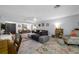 Open concept living room with an area rug and natural lighting at 1641 Jeffords St, Clearwater, FL 33756