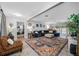 Cozy living room with tile floors, large sectional sofa, and view of the pool at 1641 Jeffords St, Clearwater, FL 33756