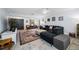 Cozy living room featuring a comfortable sectional sofa, modern decor, and an inviting area rug at 1641 Jeffords St, Clearwater, FL 33756