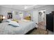 Comfortable main bedroom with ensuite bathroom, walk-in closet, and neutral walls to accommodate a variety of styles at 1641 Jeffords St, Clearwater, FL 33756