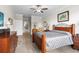 Relaxing bedroom features wood-look flooring, and an ensuite bathroom for convenience at 16898 Balance Cv, Land O Lakes, FL 34638