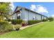 Exterior shot of the home with well-manicured lawn and shrubbery at 16898 Balance Cv, Land O Lakes, FL 34638
