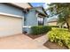 A beautifully landscaped front yard leads to a charming single-Gathering home at 16898 Balance Cv, Land O Lakes, FL 34638