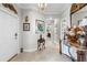 Foyer entryway featuring tile floors, elegant decor, and access to multiple rooms at 16898 Balance Cv, Land O Lakes, FL 34638