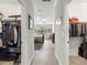 Hallway view of the bedroom with walk-in closets on both sides of the hall at 16898 Balance Cv, Land O Lakes, FL 34638