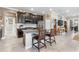 A gourmet kitchen boasts dark wood cabinets, granite countertops, and modern appliances perfect for culinary enthusiasts at 16898 Balance Cv, Land O Lakes, FL 34638