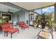 Outdoor lanai featuring plants, outdoor seating, and a ceiling fan for relaxing and entertainment at 16898 Balance Cv, Land O Lakes, FL 34638