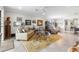 Open concept living room that features art, neutral decor, a dining area, and comfortable furnishings at 16898 Balance Cv, Land O Lakes, FL 34638