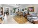 Spacious living room filled with natural light and a cozy ambiance from the plush seating at 16898 Balance Cv, Land O Lakes, FL 34638