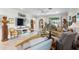 Bright living room showcasing stylish furnishings, neutral tones, and seamless flow to the outdoors at 16898 Balance Cv, Land O Lakes, FL 34638