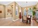 Open concept dining room showcasing arched doorways, tile flooring and natural light at 17203 Talence Ct, Tampa, FL 33647