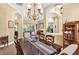 Well-lit dining room open to other living spaces, offering a view to the pool at 17203 Talence Ct, Tampa, FL 33647