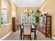 Dining room featuring natural light, elegant furnishings, and tile flooring at 17203 Talence Ct, Tampa, FL 33647
