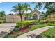 Charming home featuring a well-maintained lawn and mature trees at 17203 Talence Ct, Tampa, FL 33647