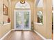 Inviting foyer featuring tile flooring and decorative glass doors at 17203 Talence Ct, Tampa, FL 33647
