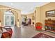 Spacious open living and dining area with tile flooring and elegant architectural details at 17203 Talence Ct, Tampa, FL 33647