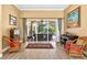 Bright living room with view of pool area with sliding glass doors and neutral decor at 17203 Talence Ct, Tampa, FL 33647