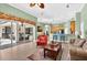 Inviting living room seamlessly connects to the kitchen and outdoor patio, creating an ideal space for gatherings at 17203 Talence Ct, Tampa, FL 33647