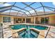 Inviting pool and spa surrounded by a screened enclosure at 17203 Talence Ct, Tampa, FL 33647