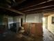 Unfinished basement with exposed wooden beams, offering the opportunity for renovations at 1835 15Th S Ave, St Petersburg, FL 33712