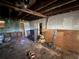 Unfinished basement with exposed wooden beams, offering the possibility for renovations at 1835 15Th S Ave, St Petersburg, FL 33712