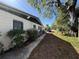 Exterior side view of home with walkway, bars on the windows and a truck parked on the street at 1835 15Th S Ave, St Petersburg, FL 33712
