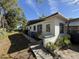 Angle of exterior, featuring door access, mature trees, and foliage at 1835 15Th S Ave, St Petersburg, FL 33712