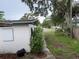 View of the side of the building and lawn with trees and street beyond at 1835 15Th S Ave, St Petersburg, FL 33712