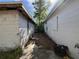 View of the side of two buildings on the property with concrete and debris on the ground at 1835 15Th S Ave, St Petersburg, FL 33712