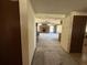 Hallway view of living room fireplace and kitchen area, needing renovation at 1835 15Th S Ave, St Petersburg, FL 33712