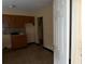 View of the kitchen, with wood cabinets and a tile backsplash at 1835 15Th S Ave, St Petersburg, FL 33712