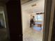 Image of an office with a desk, a dog crate, and a window, requiring renovation at 1835 15Th S Ave, St Petersburg, FL 33712