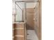 Bathroom showcasing glass shower with tile and marble accents, plus overhead shower head at 19204 Weymouth Dr, Land O Lakes, FL 34638