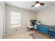 Bedroom with a white chair and window at 19204 Weymouth Dr, Land O Lakes, FL 34638