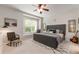 Spacious bedroom with a ceiling fan, large window and window seat plus decor at 19204 Weymouth Dr, Land O Lakes, FL 34638