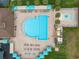 Aerial view of a community pool with lap lanes, a splash pad, and plenty of lounging space at 19204 Weymouth Dr, Land O Lakes, FL 34638