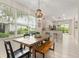 Charming dining room illuminated by natural light with a cozy wood dining table at 19204 Weymouth Dr, Land O Lakes, FL 34638