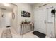 Welcoming entryway featuring a table with decorative items and Gathering photos at 19204 Weymouth Dr, Land O Lakes, FL 34638