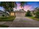 Charming single-story home with a two-car garage and well-maintained landscaping at 19204 Weymouth Dr, Land O Lakes, FL 34638