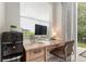 Bright home office space with a modern desk setup and natural lighting at 19204 Weymouth Dr, Land O Lakes, FL 34638
