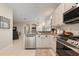 Bright kitchen with stainless steel appliances and sleek countertops at 19204 Weymouth Dr, Land O Lakes, FL 34638